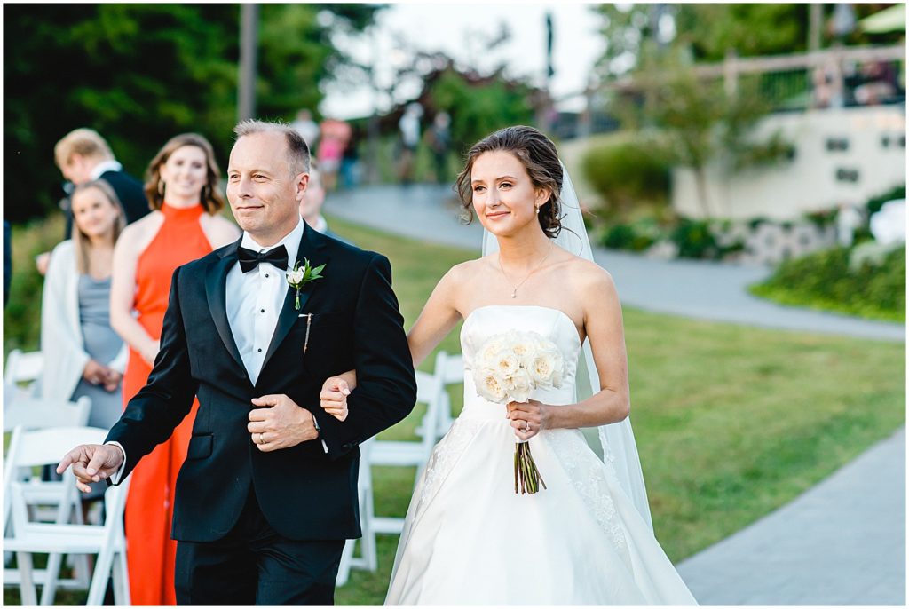 bride and father walking down aisle on wedding day