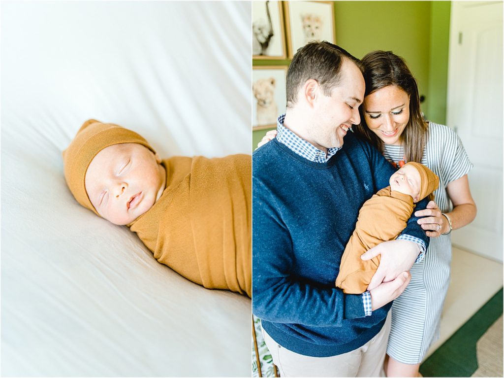 parents hold newborn baby in gold swaddle