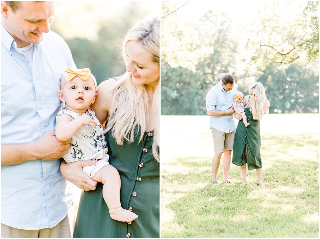 young parents smiling down at 6 month old baby girl family portrait session