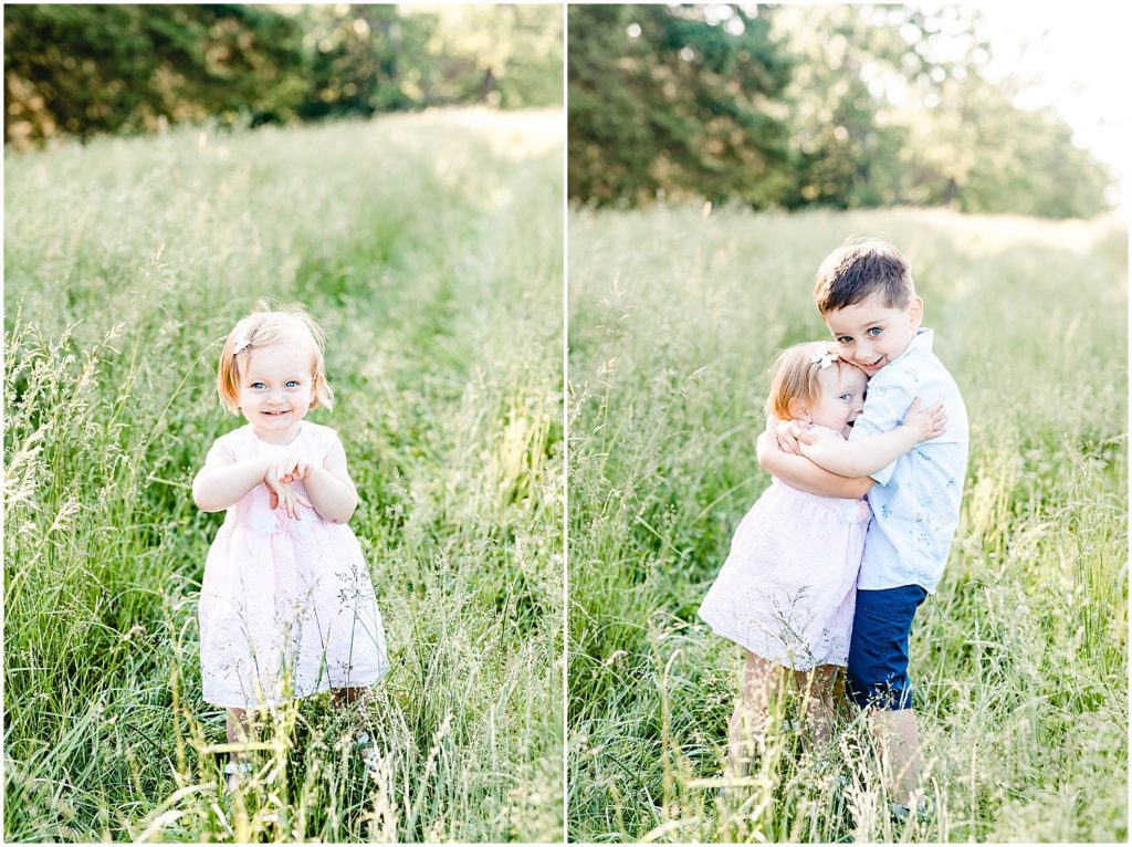 kids hugging and smiling in tall grass