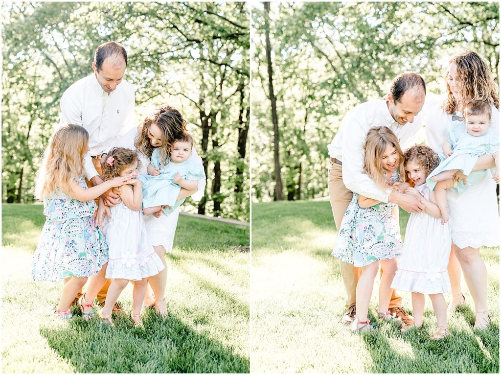 family tickling each other on grass family session