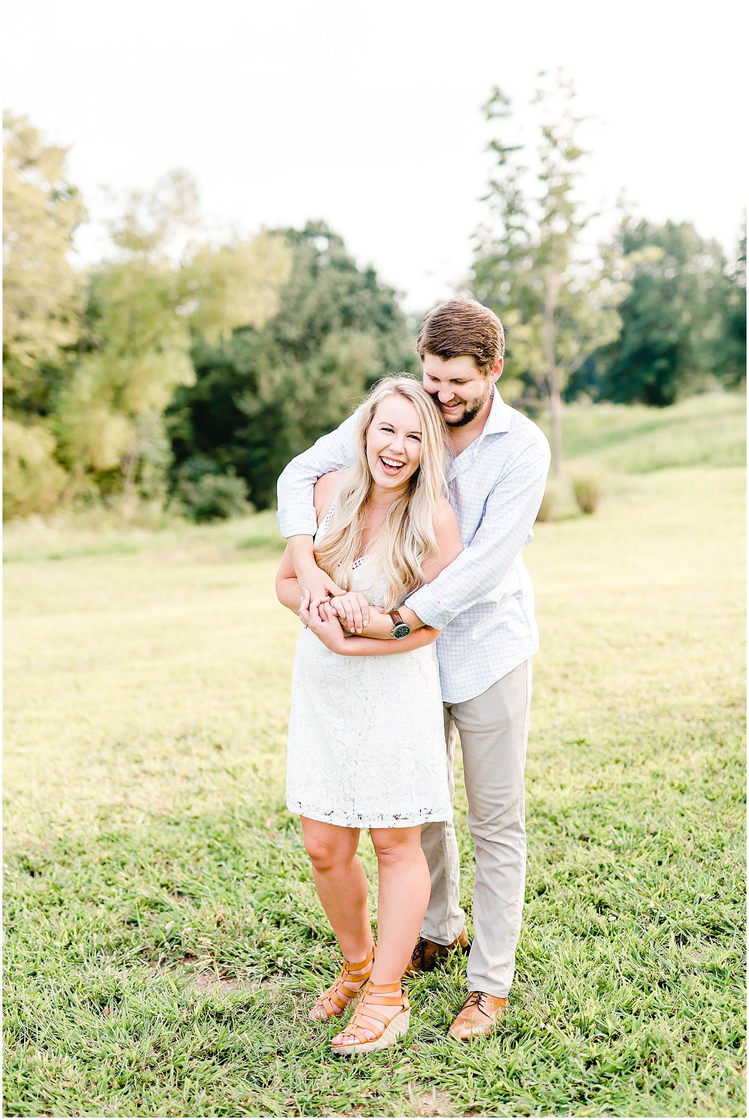 Cooper's ridge engagement session couple dancing in grass