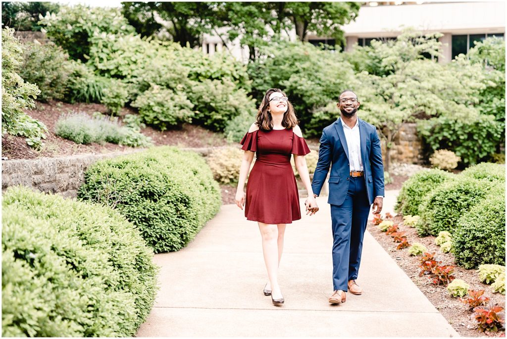 jefferson city governor's garden engagement session couple walking on path
