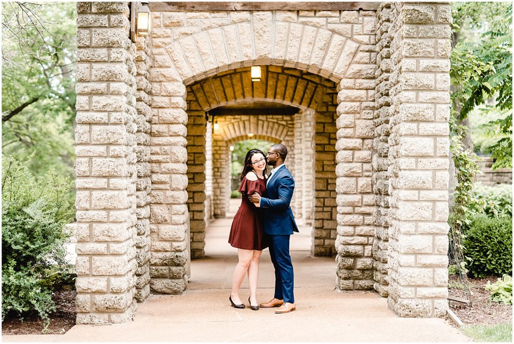 jefferson city governor's garden engagement session couple walking on path