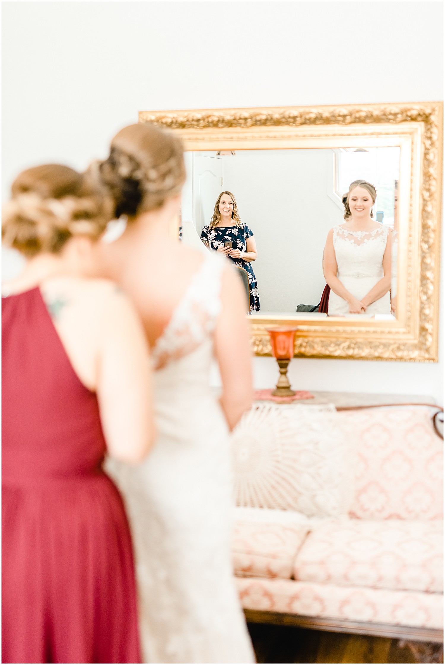 mother of bride in mirror bride getting ready