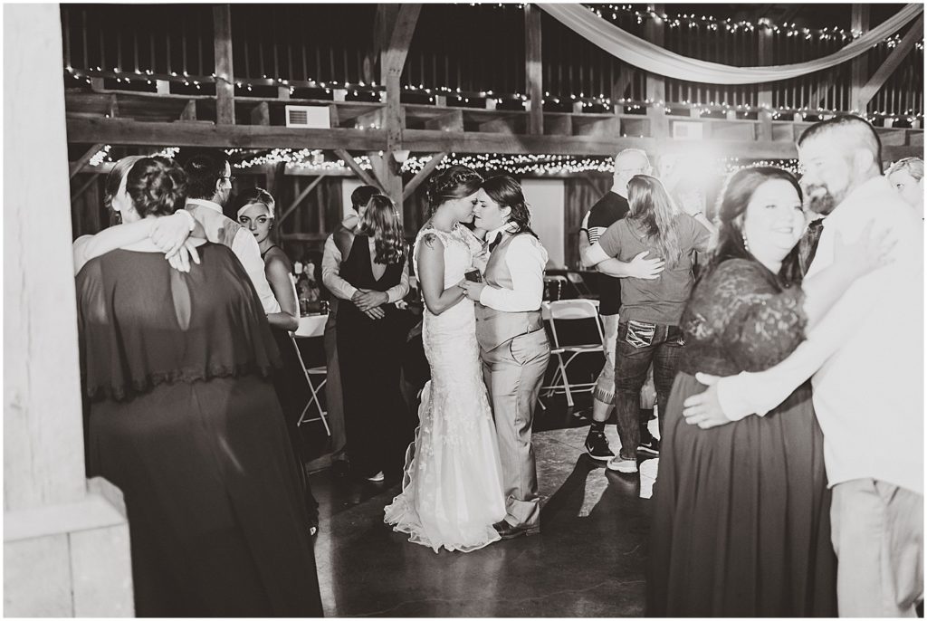 brides dancing together black and white