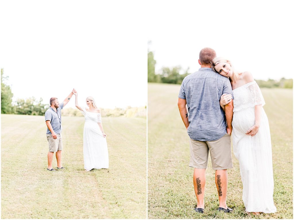 pregnant mom in white dress standing in field with husband