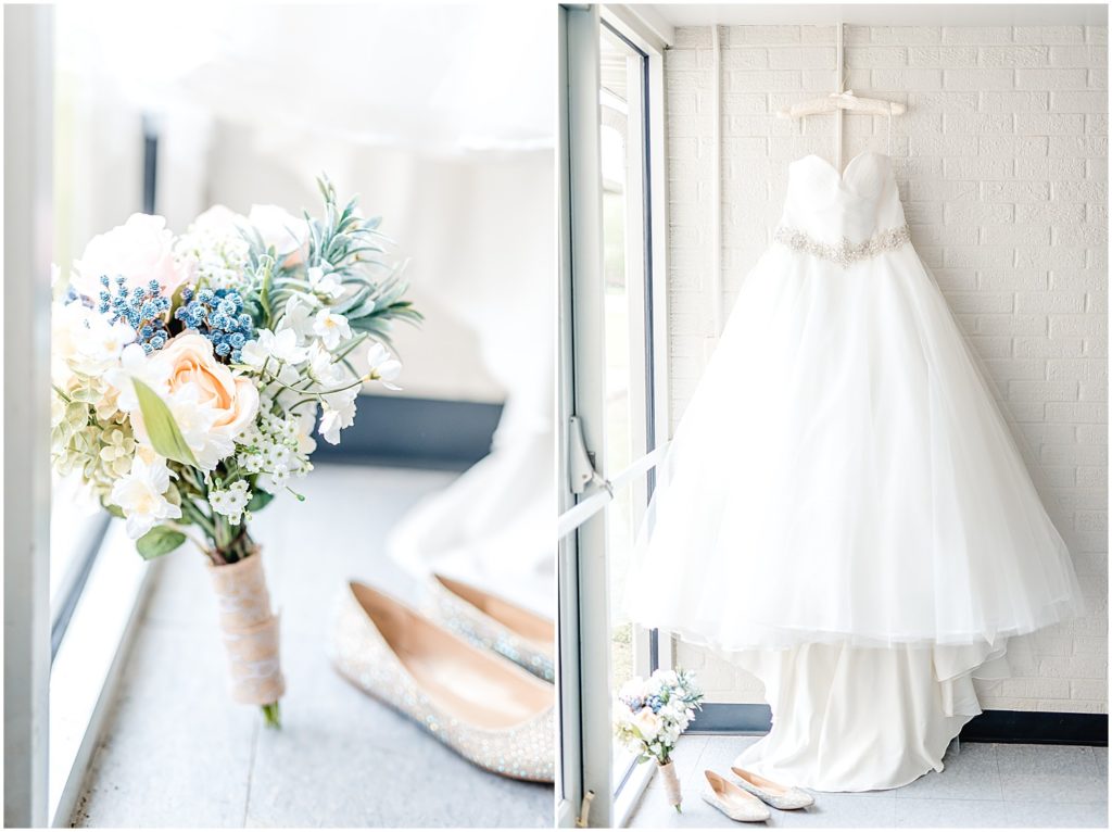 bridal bouquet and gown up against white brick wall