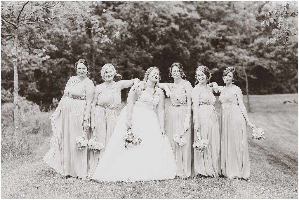 bridesmaids black and white with bride laughing