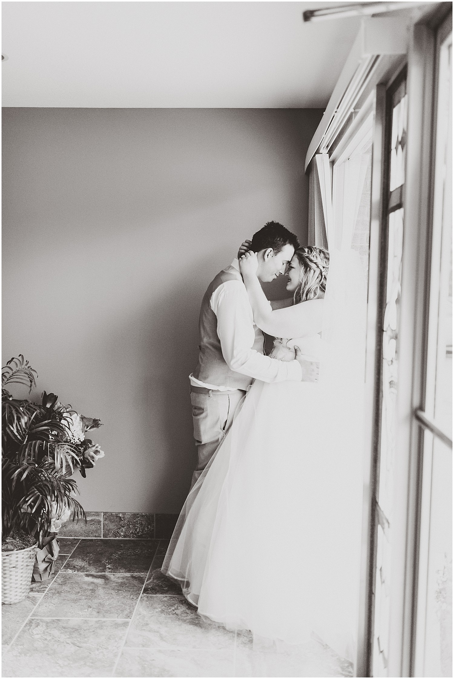 bride and groom portrait black and white against large window eldon church 