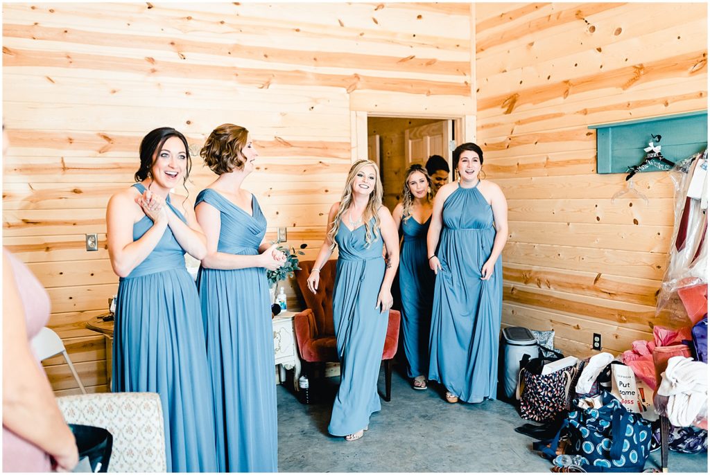 bridesmaids reveal bride gown getting ready room