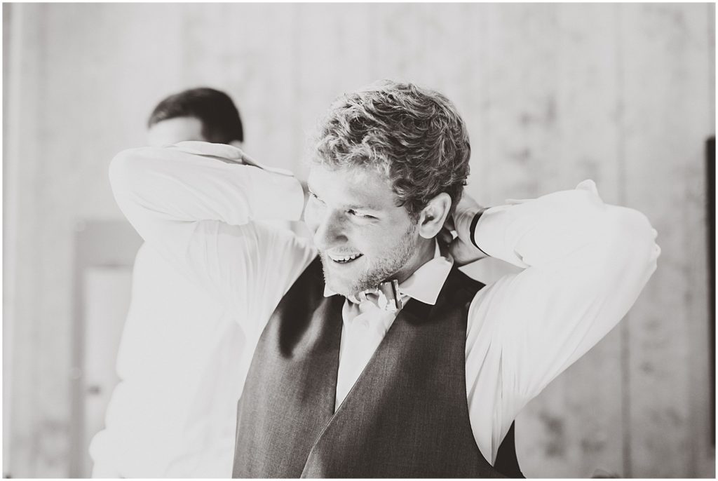 black and white groom getting ready