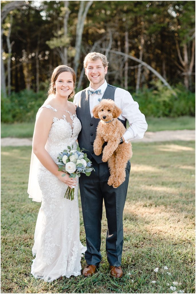 bride and groom with dog barn at honeysuckle farms wedding