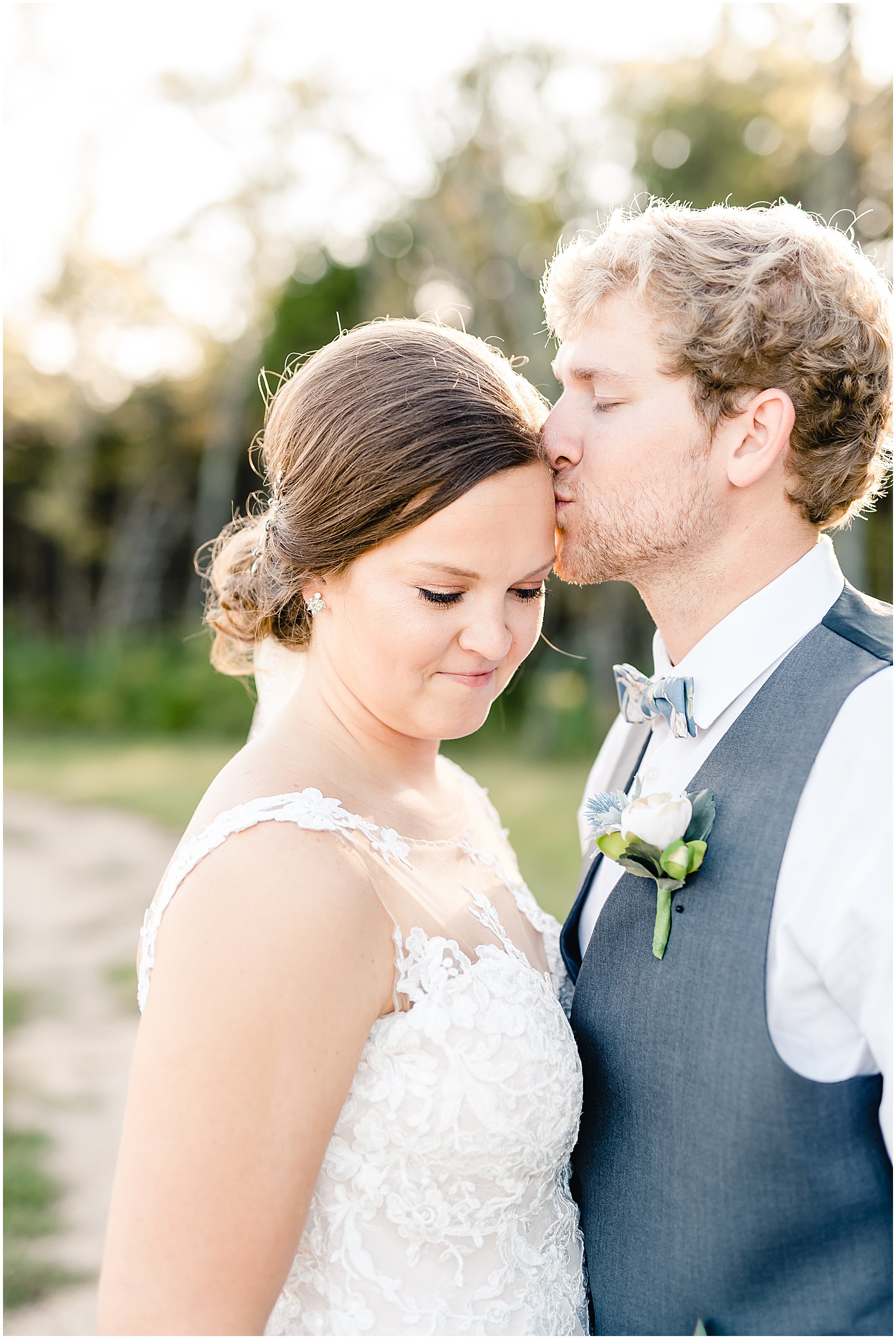 bride and groom portraits smiling kiss sunlight sun glow