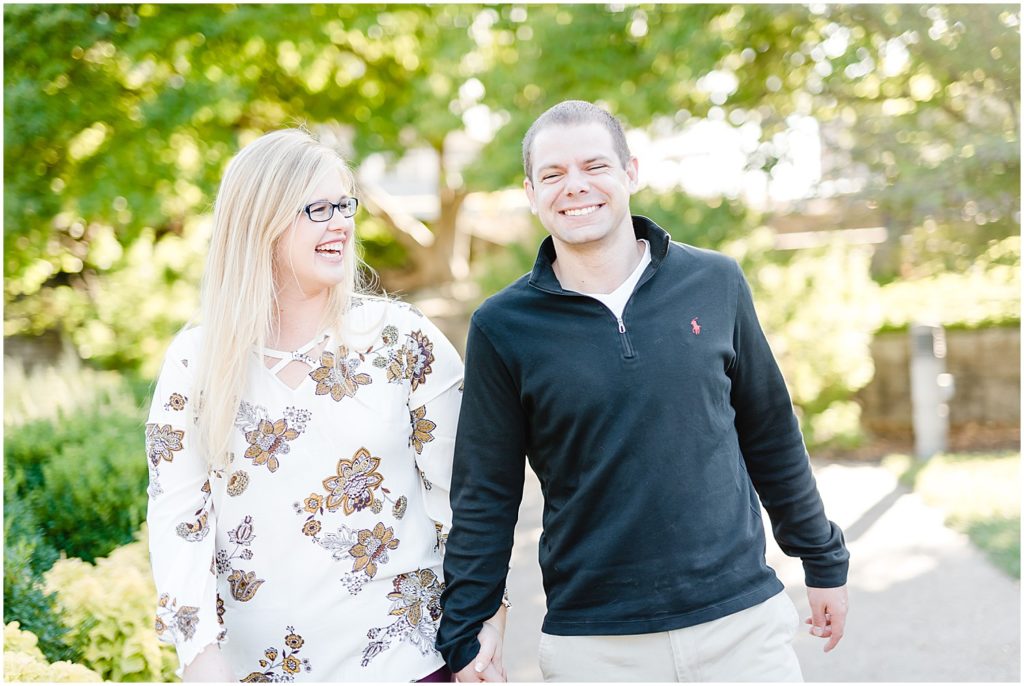 couple laughing together in park engagement session