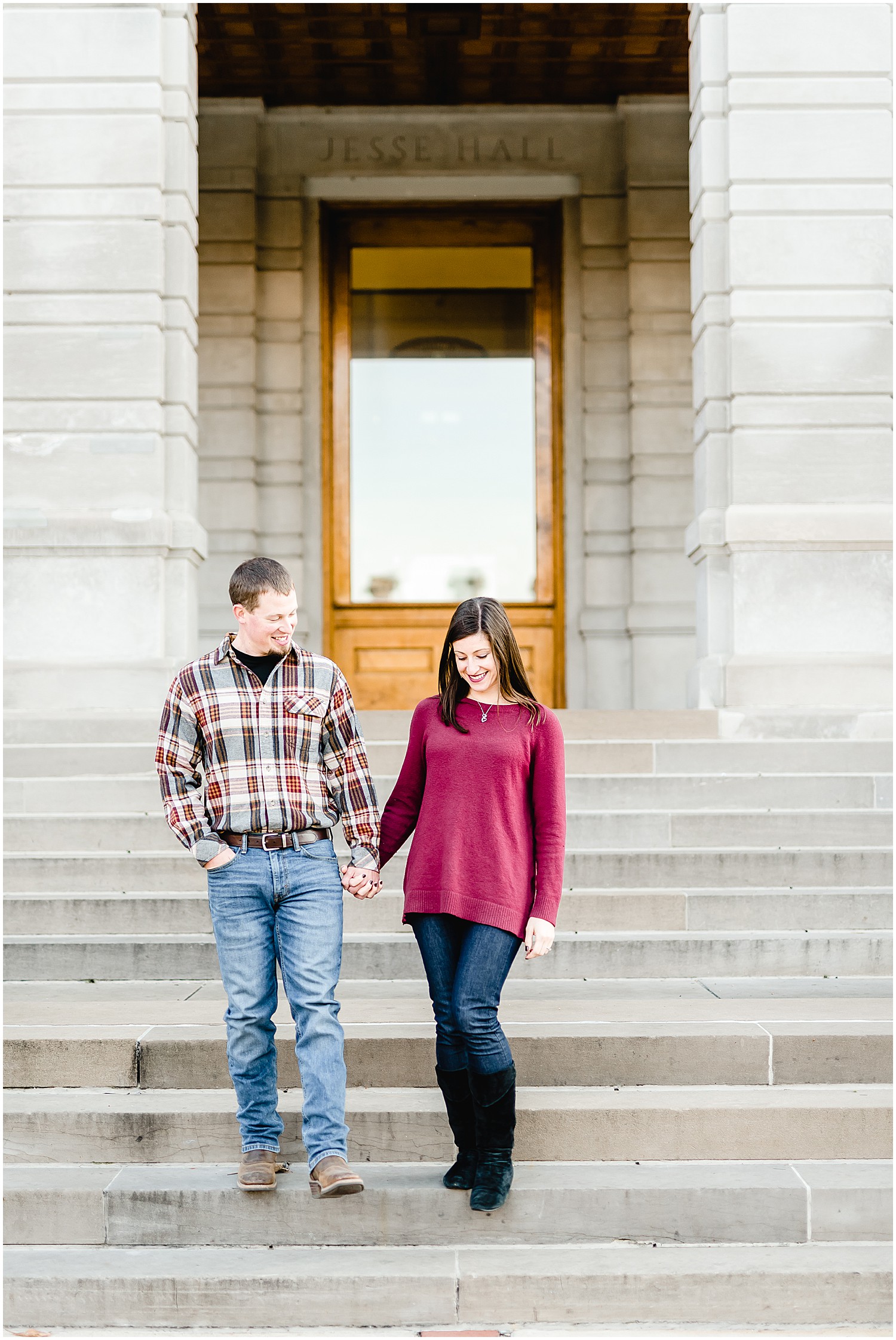 couple walking down stairs jesse hall mizzou campus engagement session
