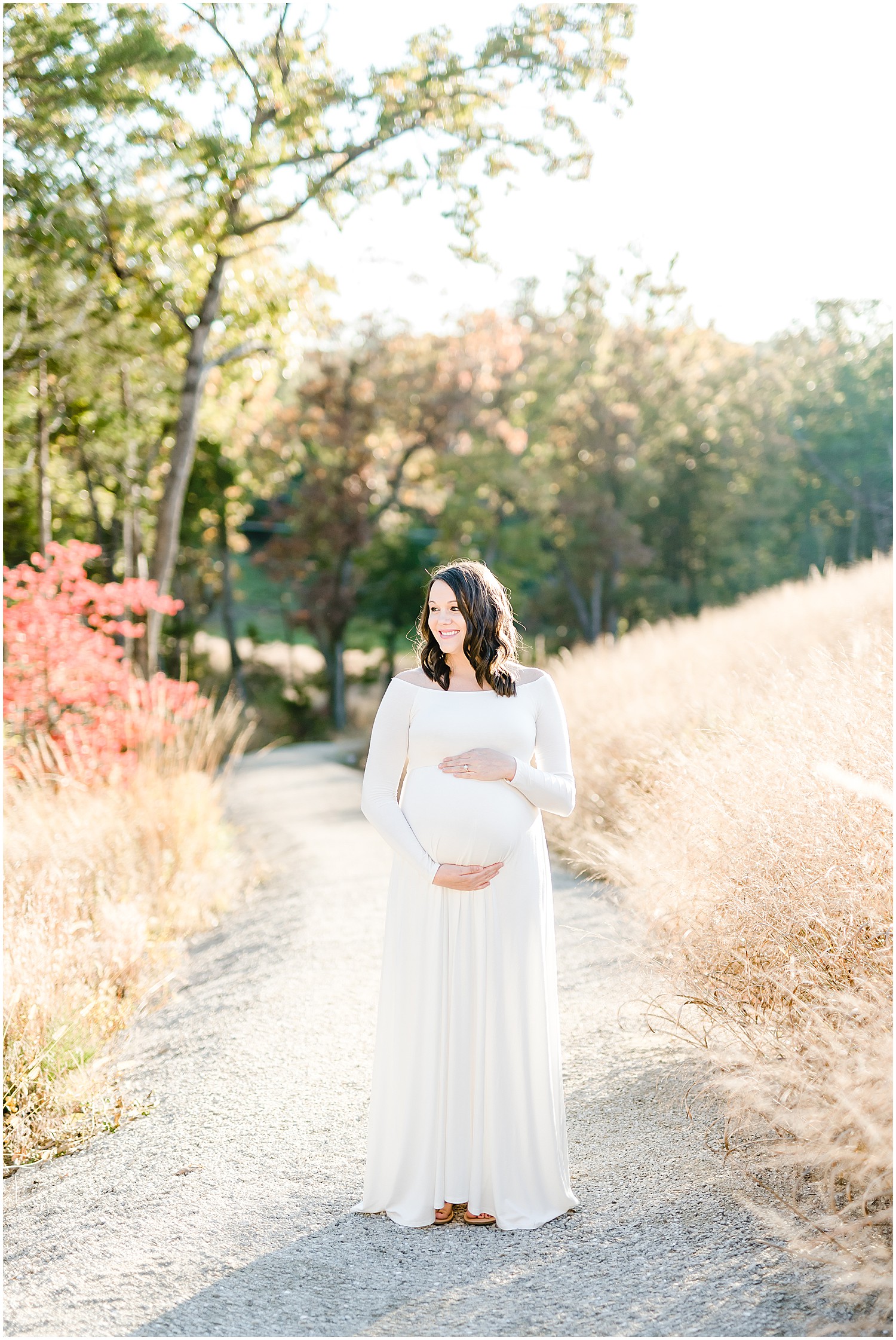 expecting mom white dress glowing sunlight field maternity session