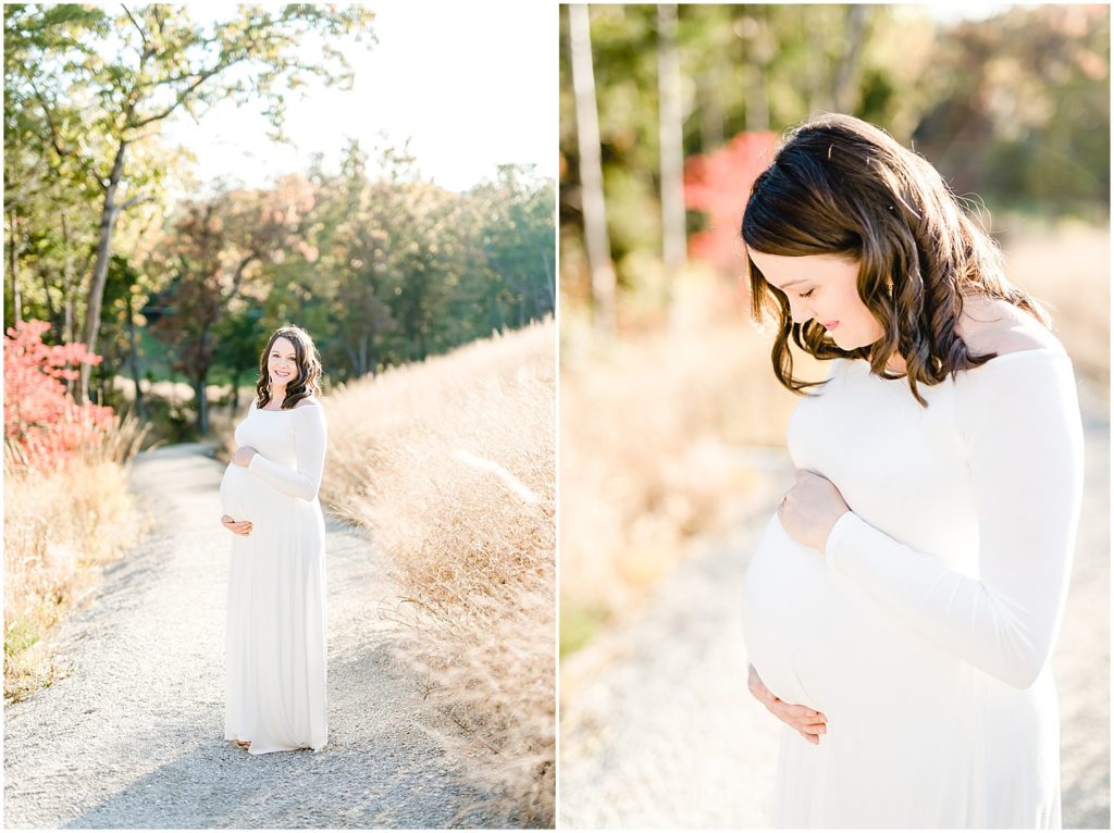 expecting mom looking at belly white maternity dress fall maternity session