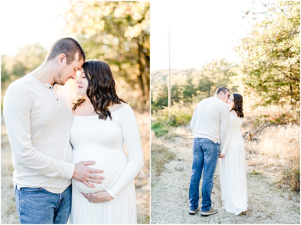 couple kissing touching foreheads touching baby belly