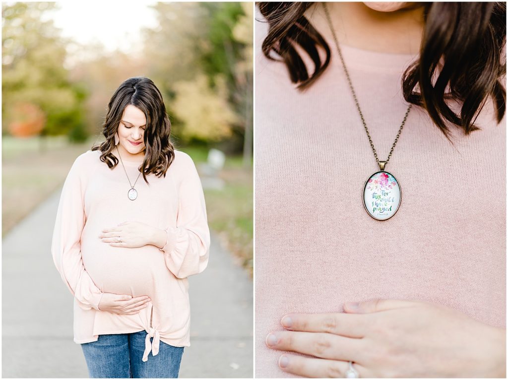 expecting mom holding baby belly up close of necklace maternity session