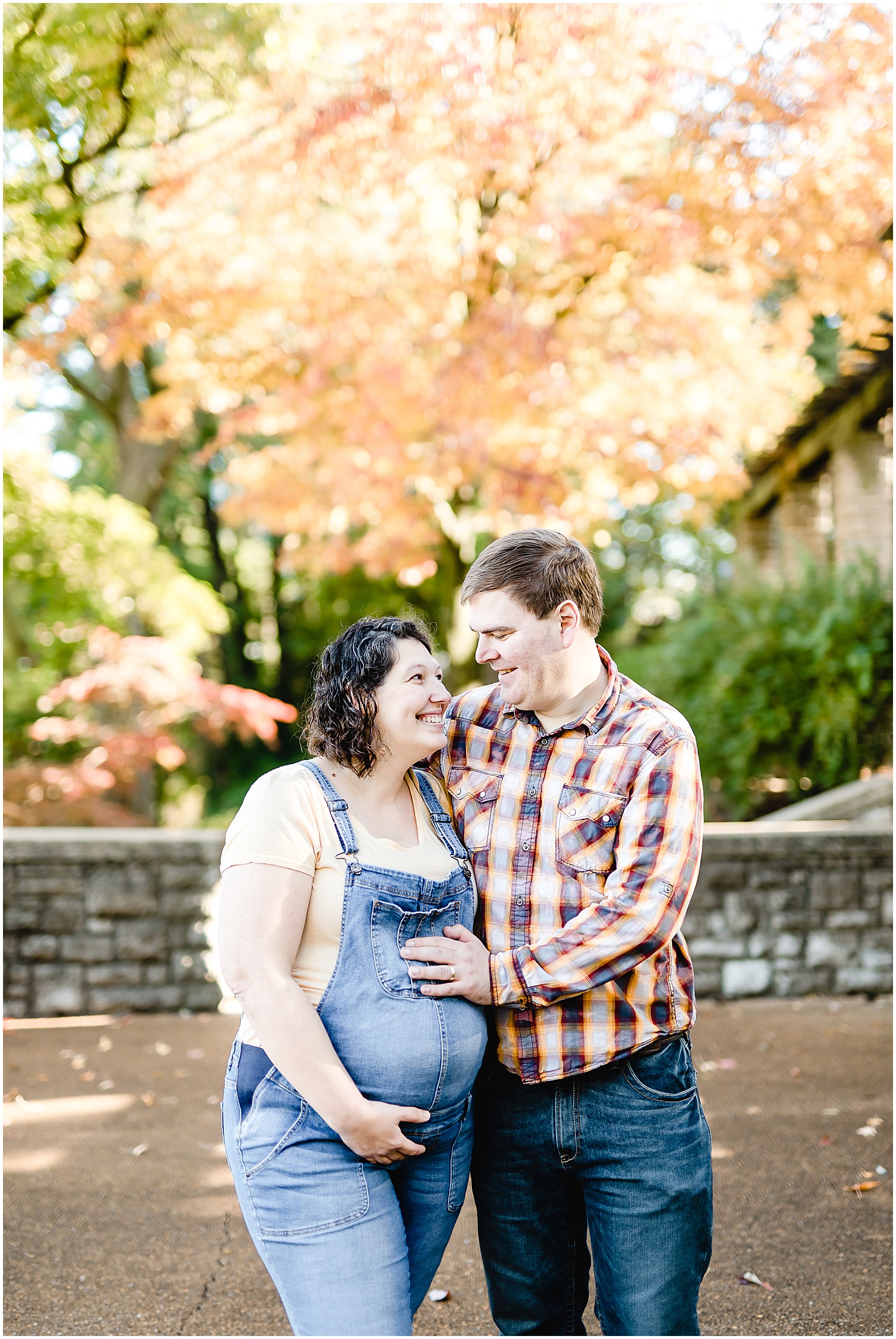pregnant couple smiling laughing Missouri governor's garden maternity session
