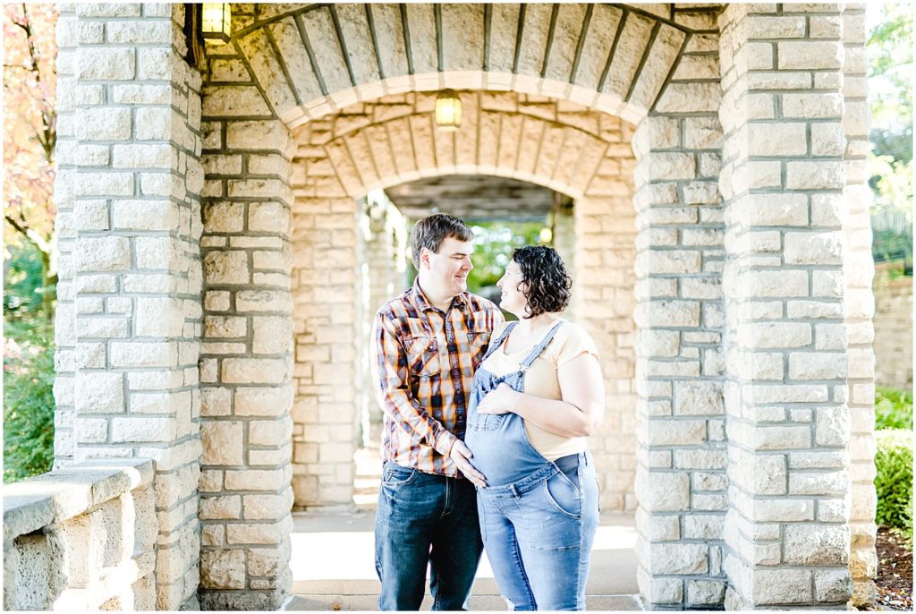 pregnant couple under arches Missouri governor's garden