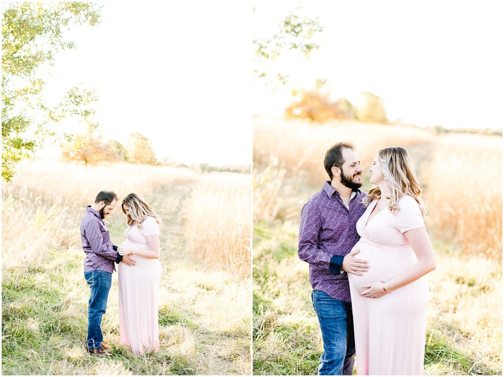 couple smiling at belly maternity session fall 