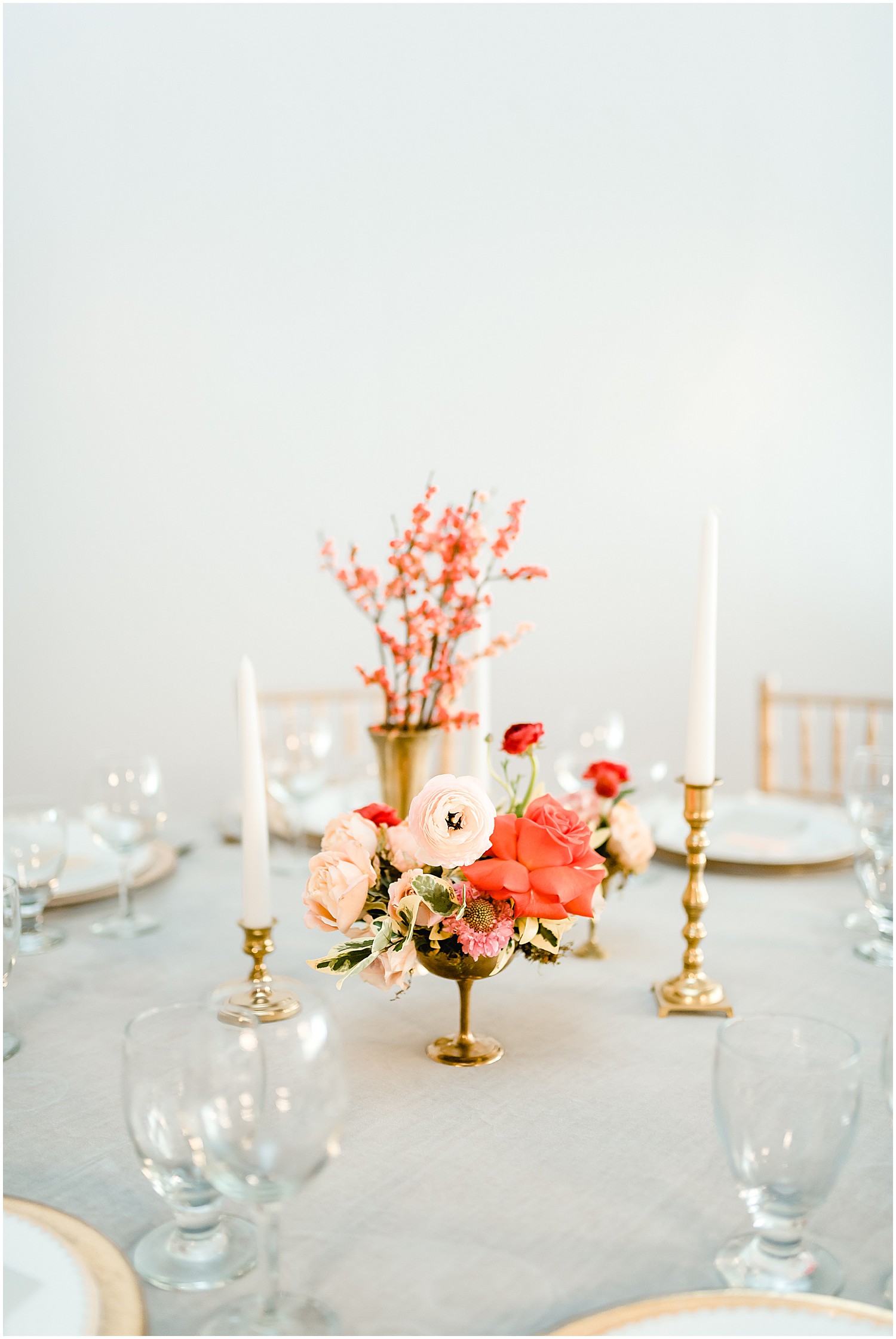 table setting details gold accents candlesticks coral florals