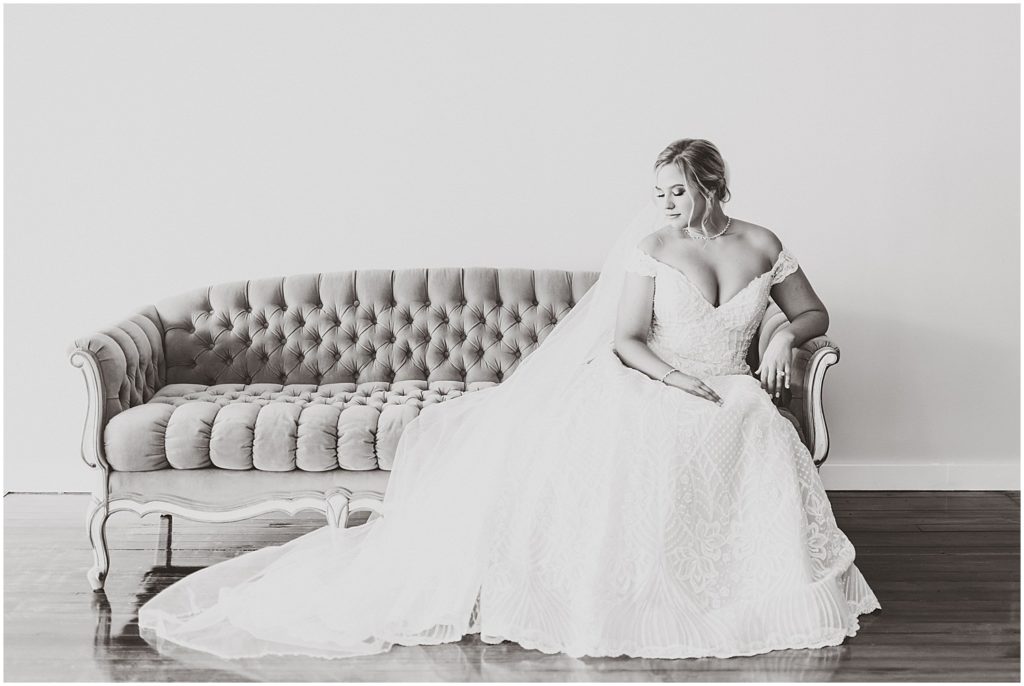 black and white bride on vintage couch