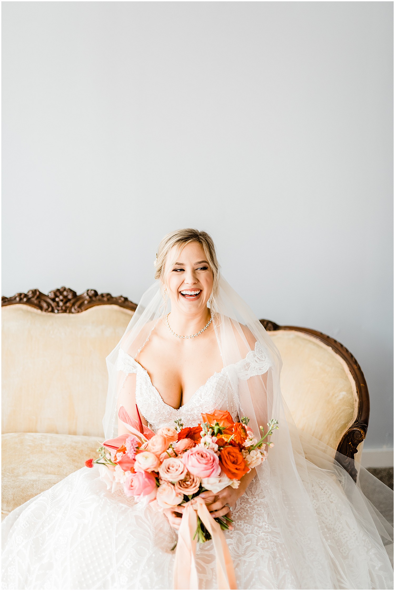 bride portrait smiling sitting on couch 