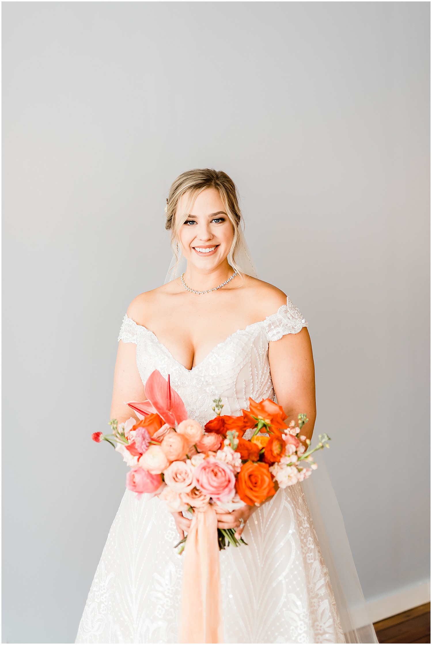 bride portrait with pink bouquet