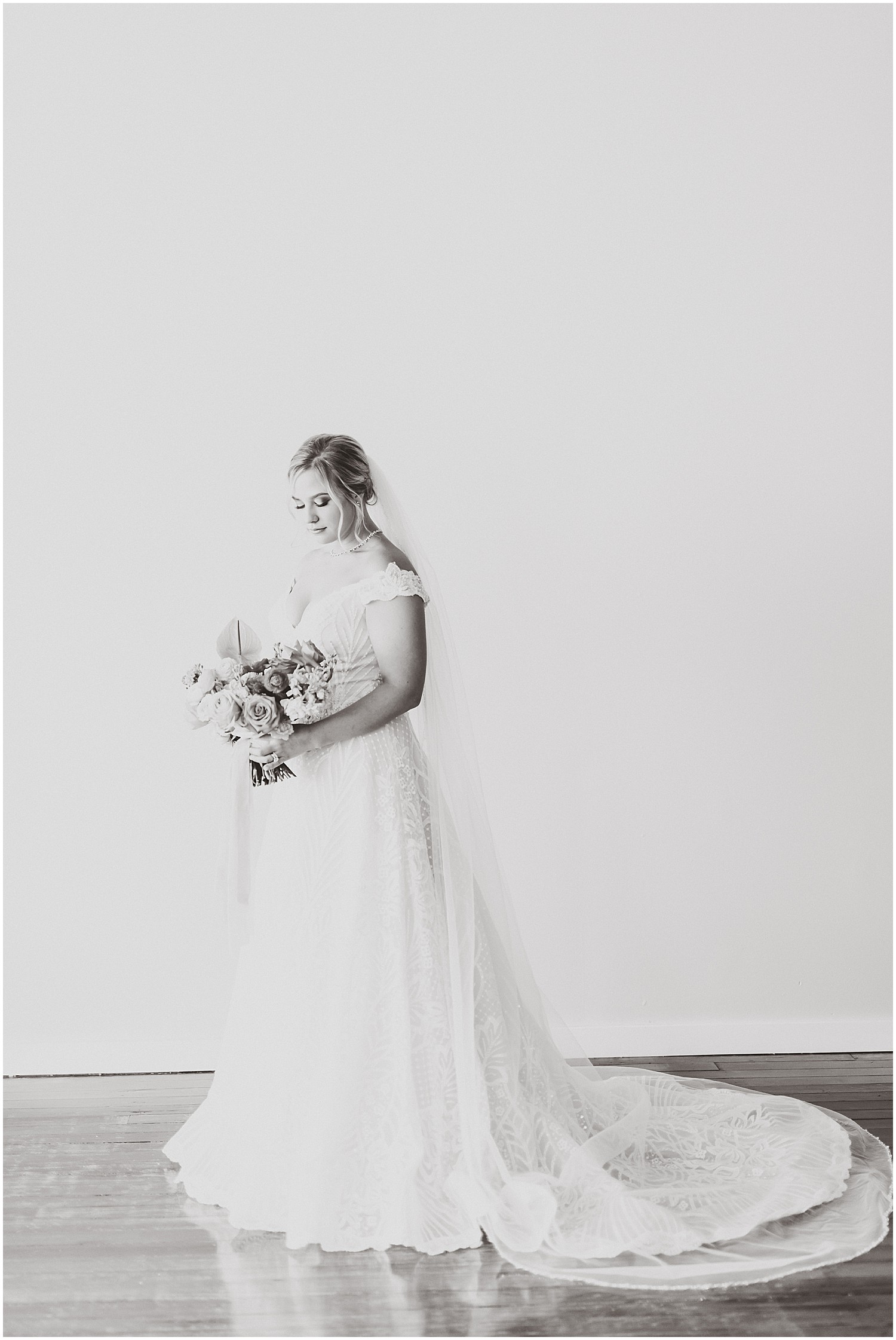 black and white bridal portrait on blank white wall