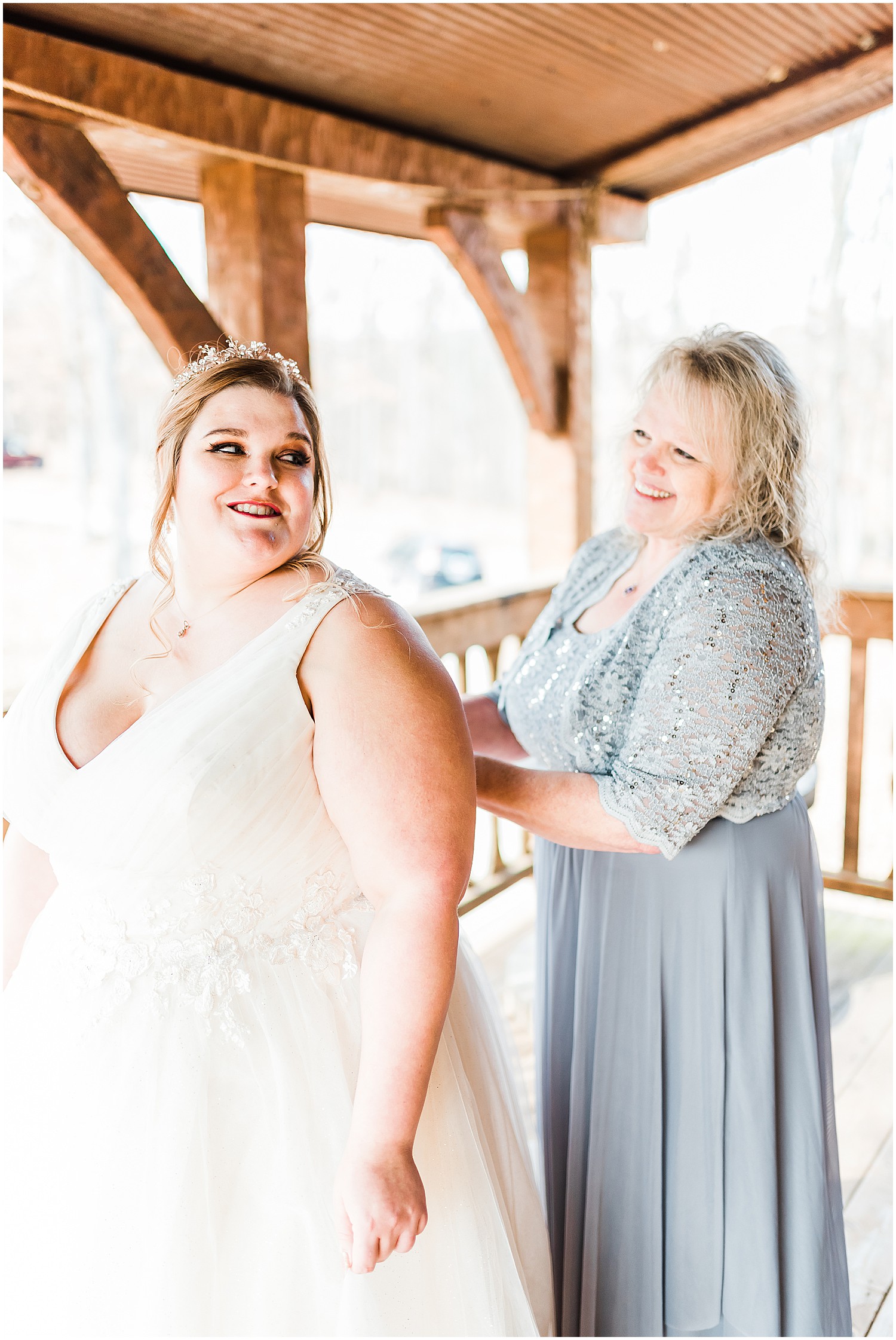 bride and mother buttoning dress getting ready weathered wisdom barn
