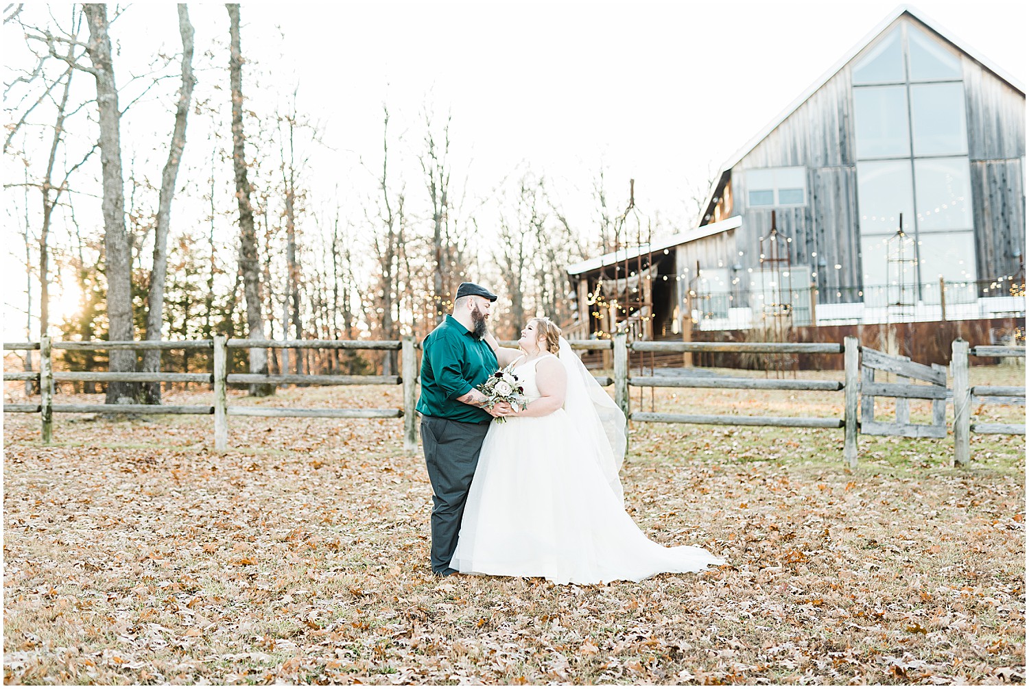 bride and groom outside weathered wisdom barn