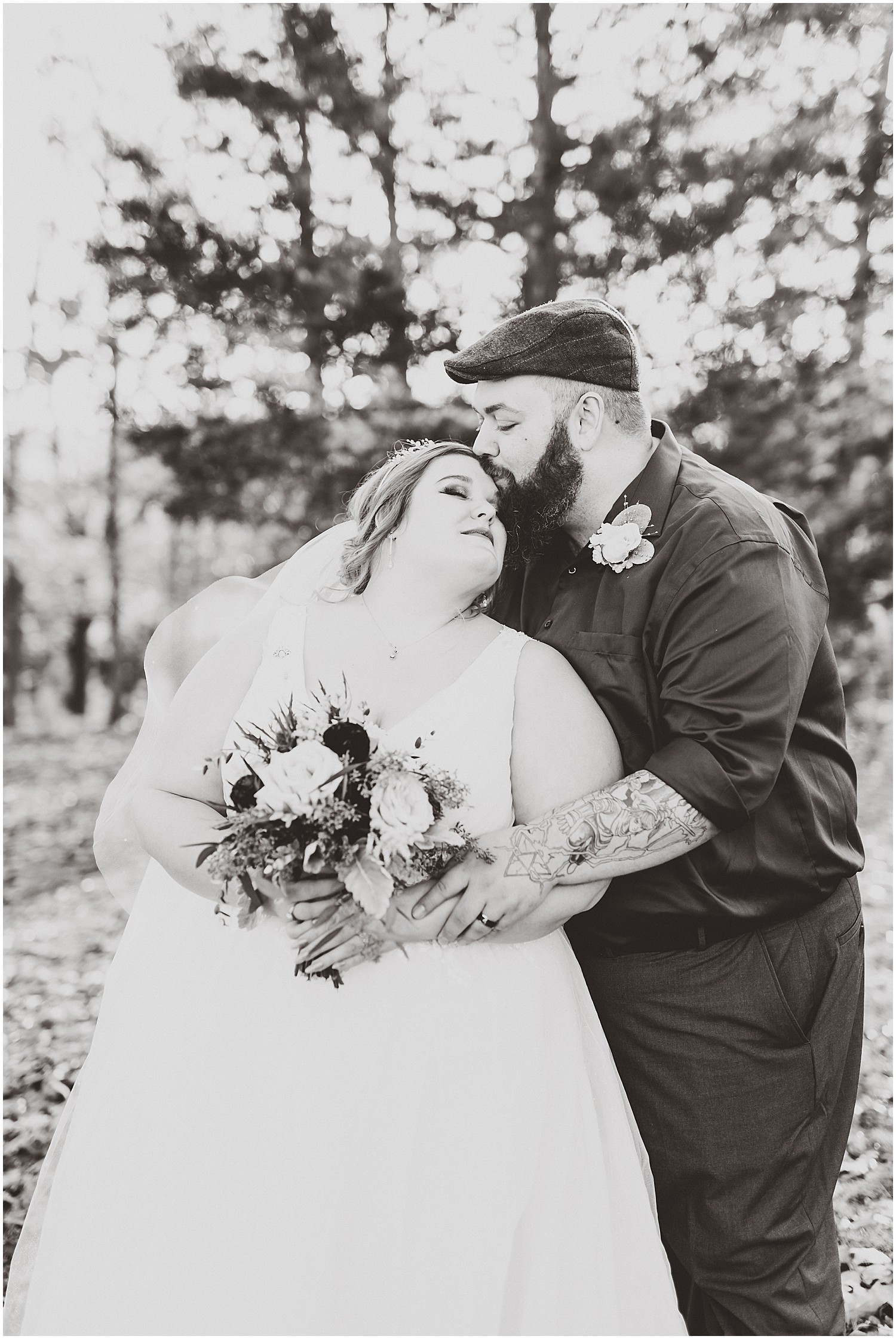 black and white bride and groom snuggle kiss