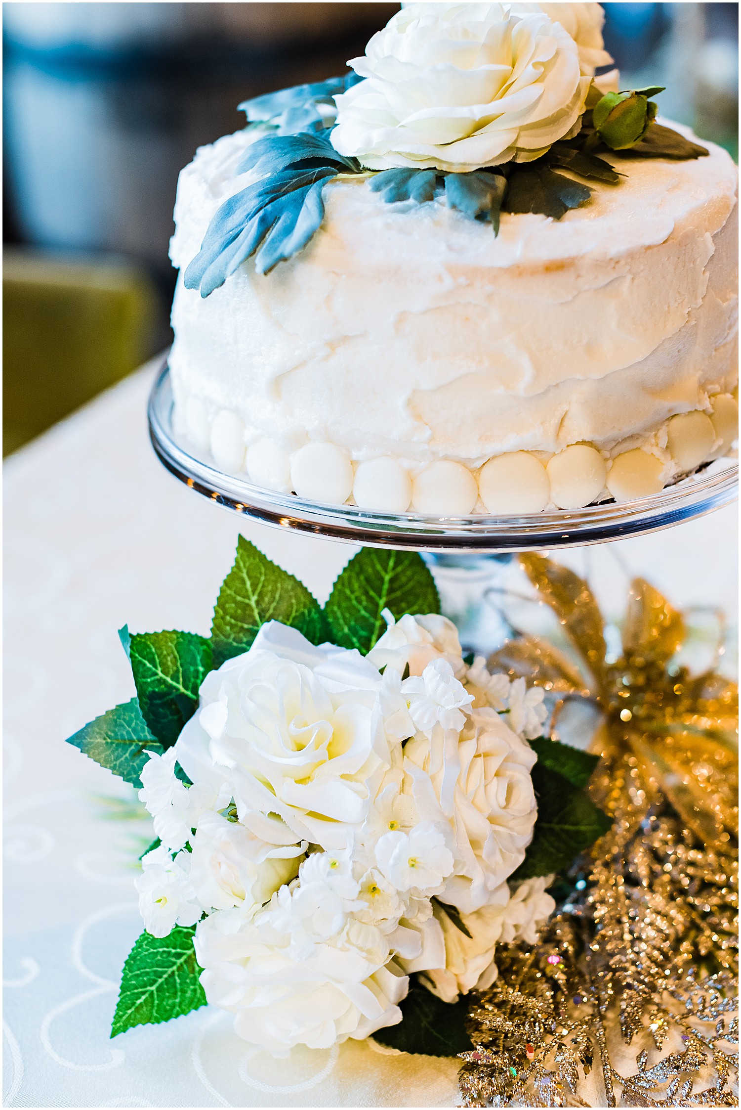 white wedding cake with floral details