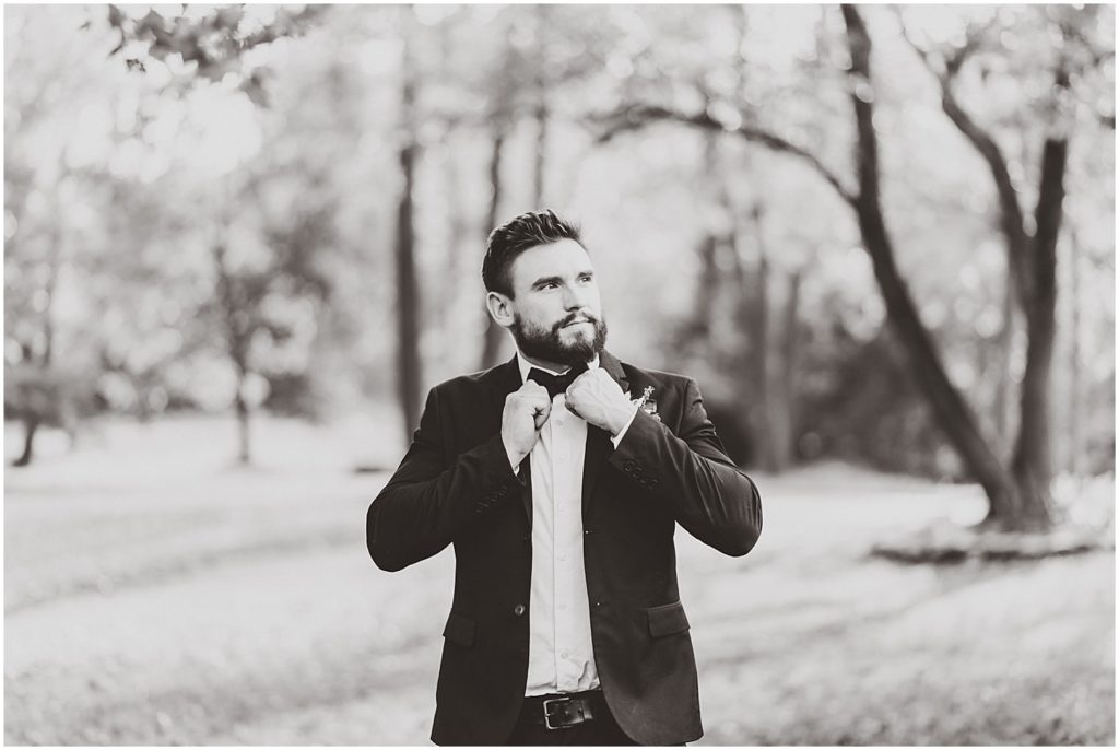 black and white groom bow tie under trees wildcliff wedding
