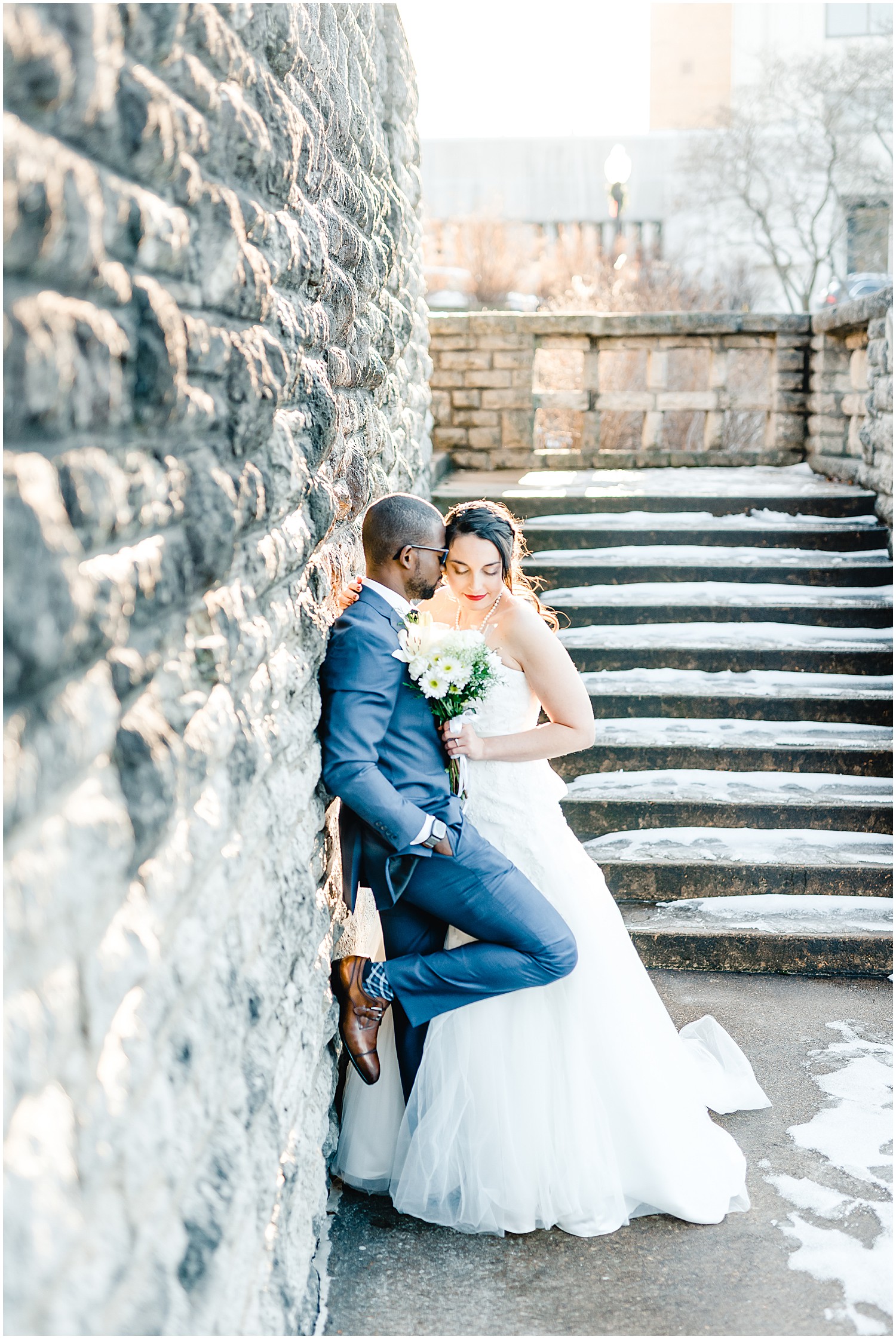 bride and groom portrait against rock wall missouri governors garden