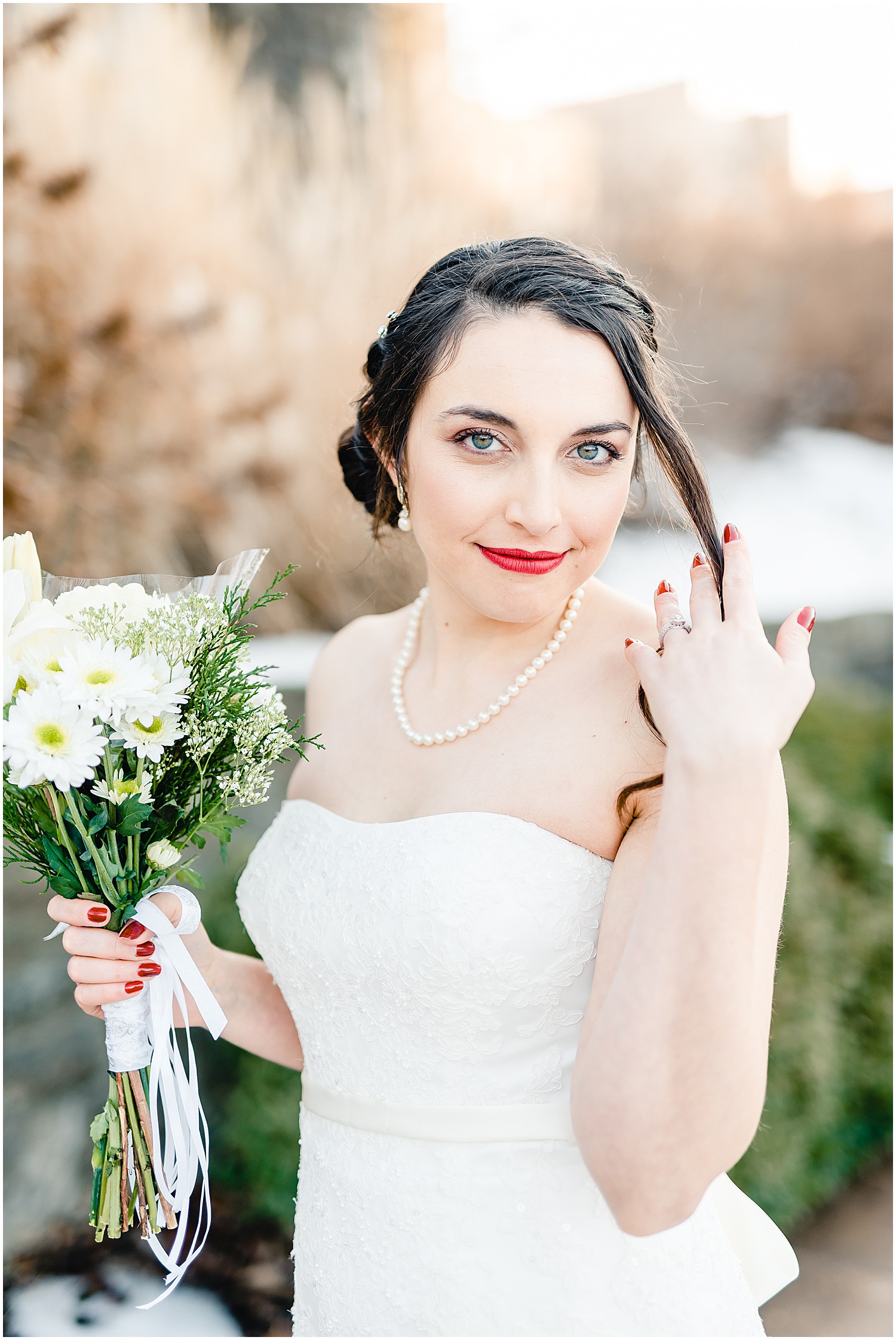bridal portrait with flowers in snow