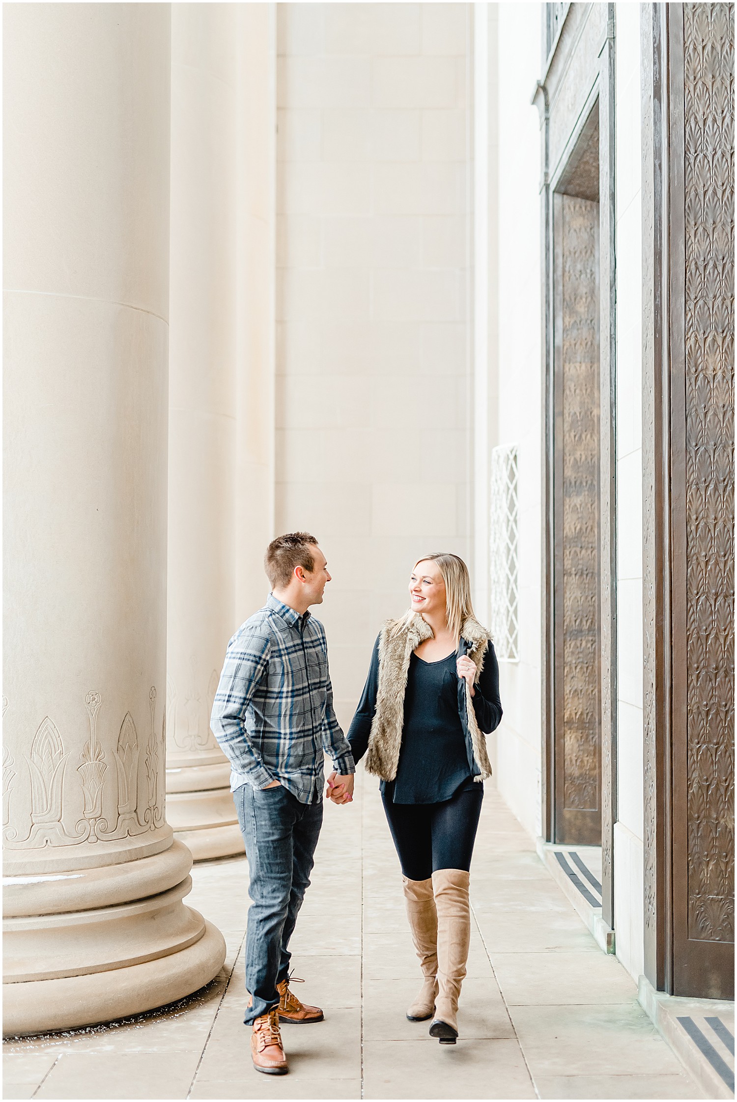 couple walking outside museum winter engagement session