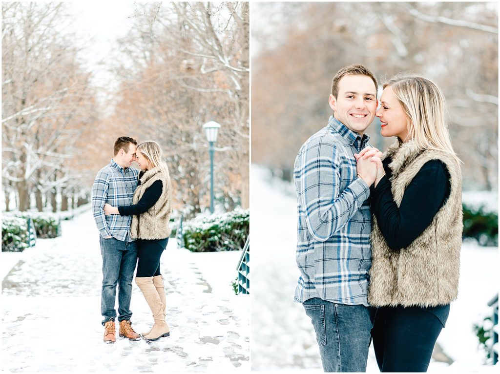 couple kissing cuddling on sidewalk snow winter engagement session