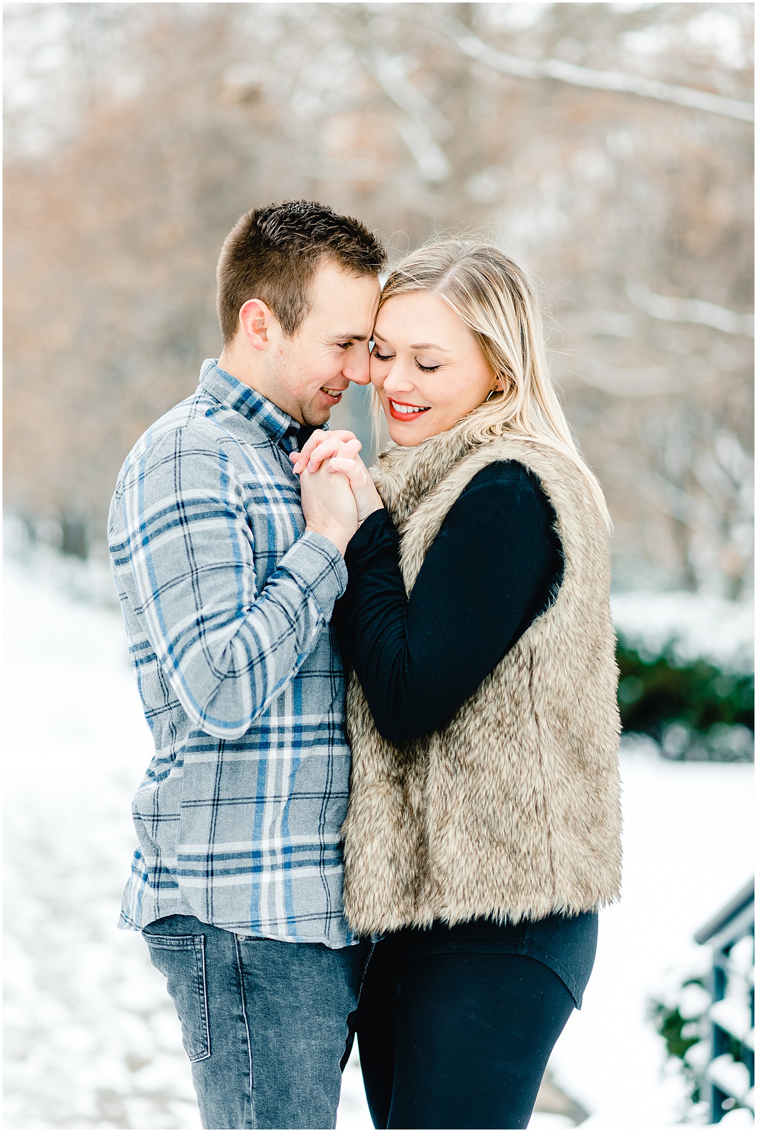 couple dancing and holding hands on sidewalk in snow