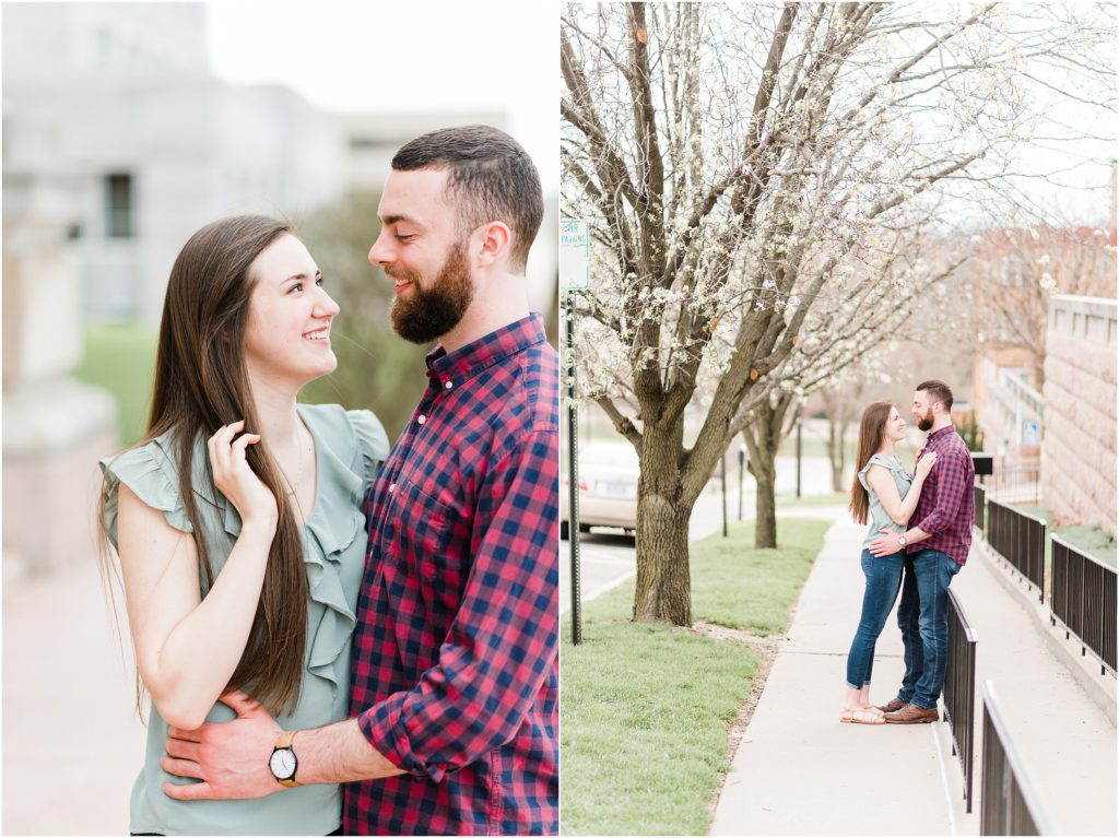 Engaged couple poses outside the Jefferson City, MO supreme court for a downtown engagement session