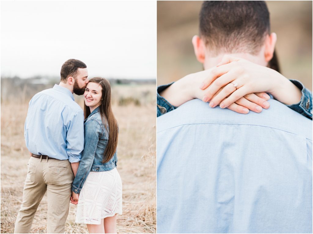 engaged couple poses in field at range nature center in jefferson city mo for engagement session