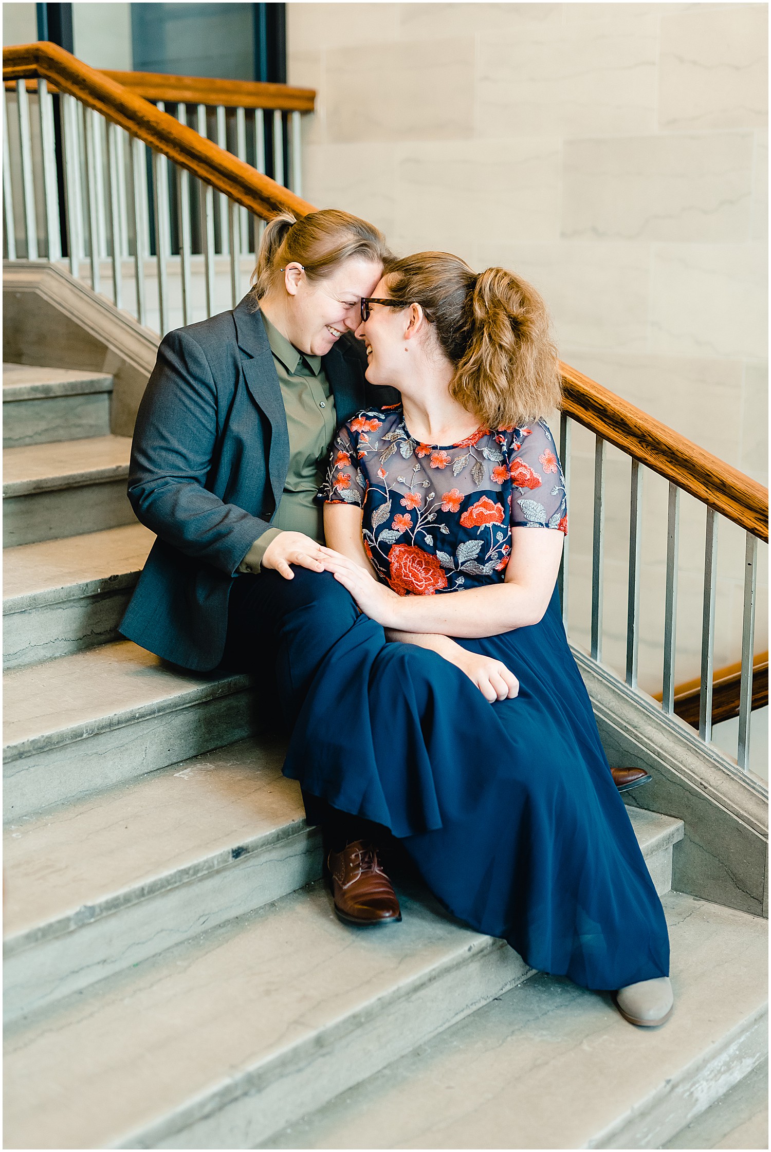 female couple sitting on courthouse steps