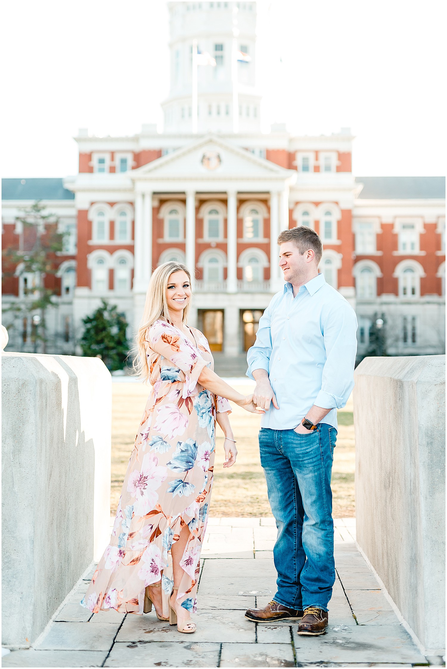 Engaged couple posing on Mizzou Campus for Columbia, MO engagement session on the mizzou columns in front of jesse hall