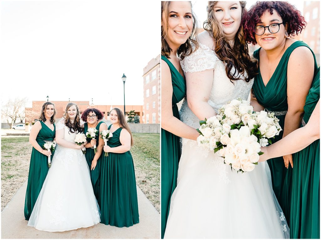 bride posing with bridesmaids and displaying white rose bouquets