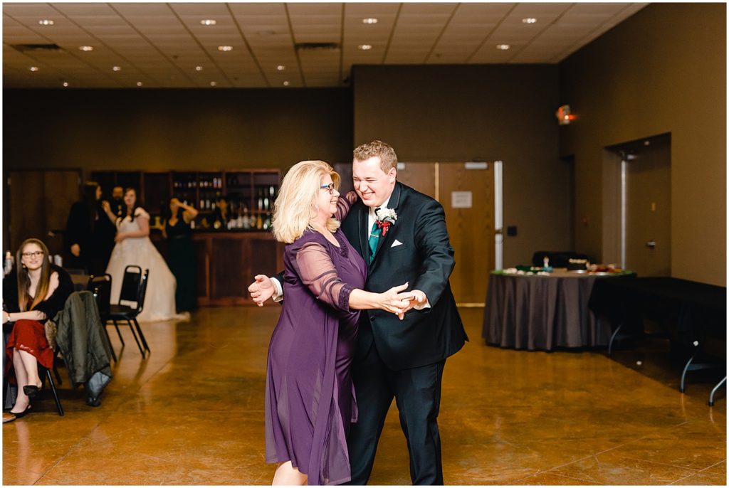 groom and his mom doing first dance during wedding reception
