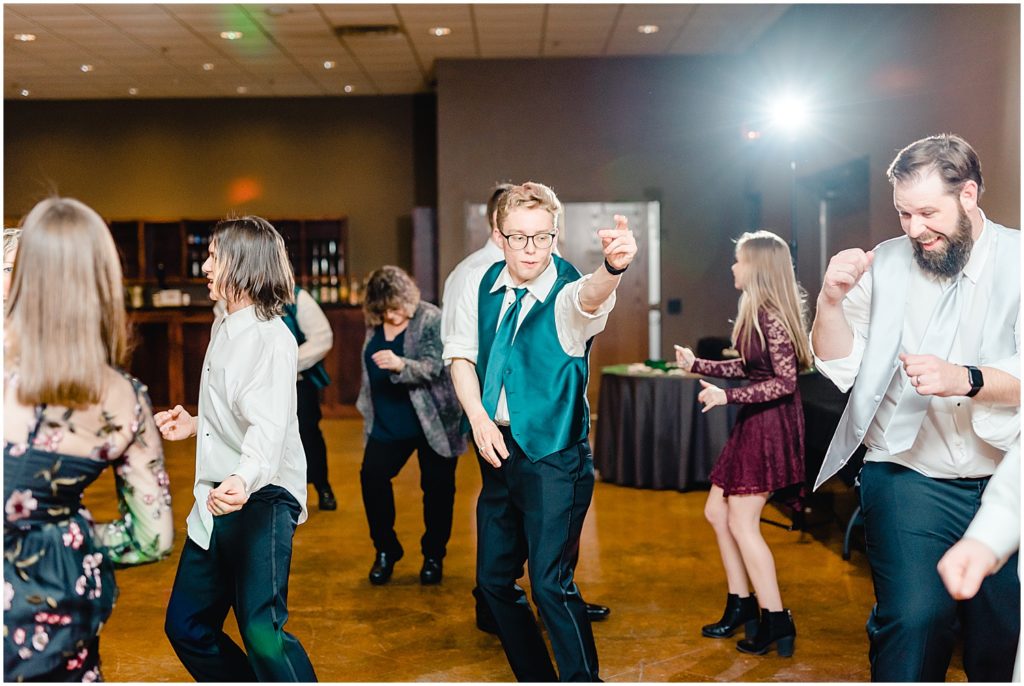 groomsmen dancing during wedding reception
