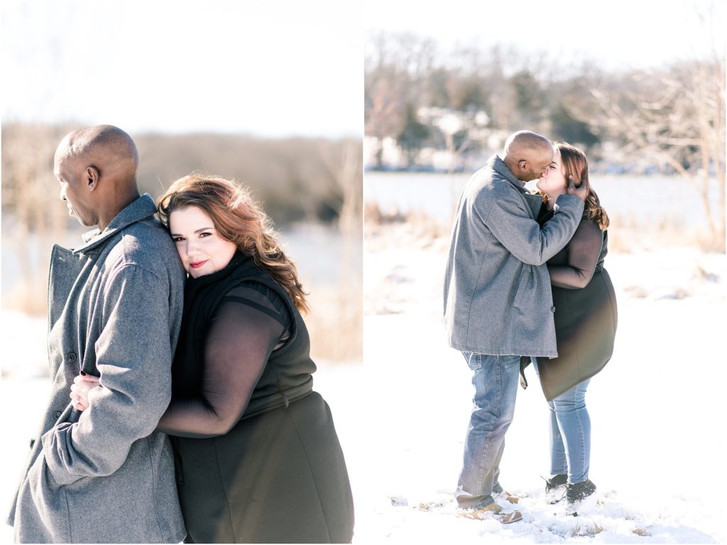 engagement photos of mixed race couple hugging and kissing in the snow